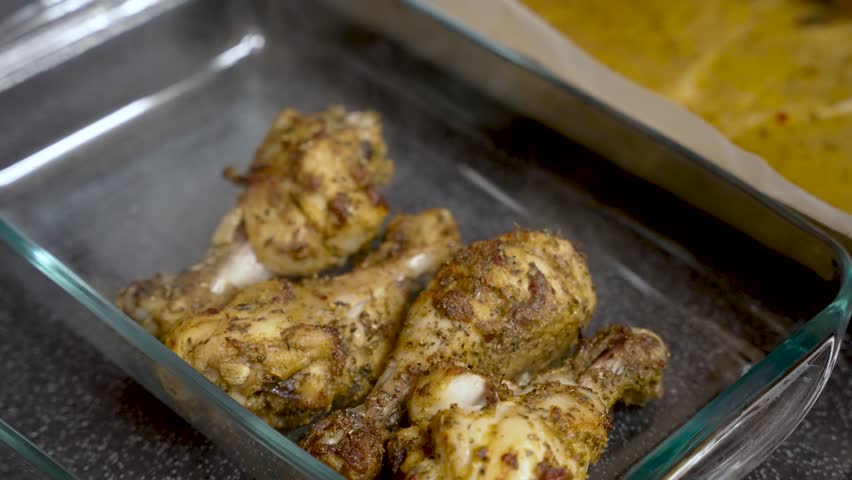 steam rising off freshly cooked chicken leg meat, showcased in a close-up bowl shot, evokes the anticipation of delicious food preparation. slow motion shot