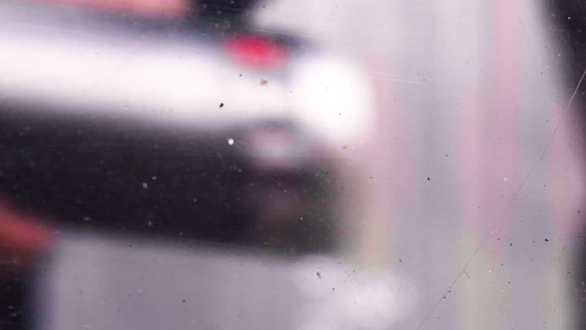 Spraypaint POV on lens, street art, graffiti spraying close-up, colorful creative background transition