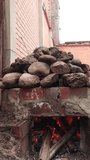 Video of a pachamanca oven with fire inside. 