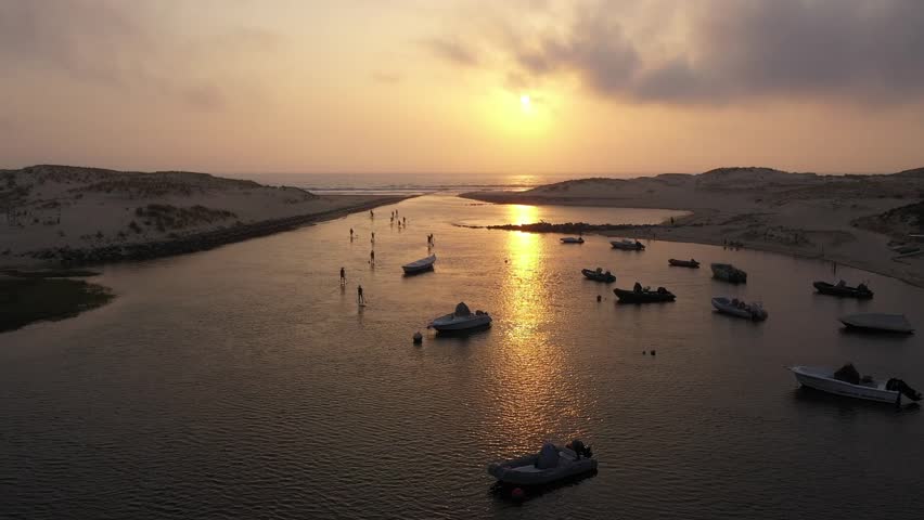 Saint-Julien-en-Born, France : Stand Up Paddles near Contis-Plage on Sunset