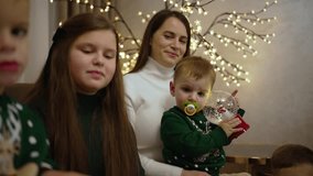 Family Celebration with Snow Globe and Christmas Lights. Cozy family photo with festive atmosphere. Concept Family Celebration - Powered by Shutterstock - Get 15% off with code: PIKWIZARD15