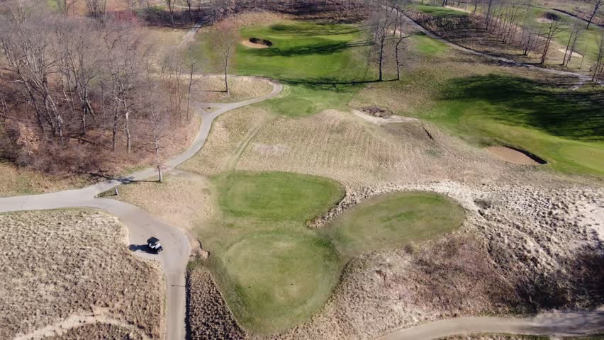 Spring hues embrace golfing haven.