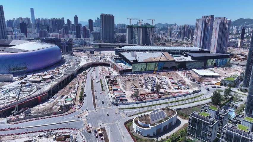Seaside commercial residential construction project in Kai Tak Sports Park Cruise Terminal Hong Kong, Kwun Tong and Kowloon Bay near Victoria harbour, Aerial drone skyview