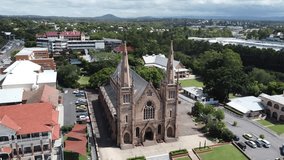 Drone descending front of a large Catholic Church in Australia