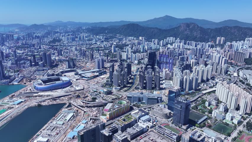Seaside commercial residential construction project in Kai Tak Sports Park Cruise Terminal Hong Kong, Kwun Tong and Kowloon Bay near Victoria harbour, Aerial drone skyview