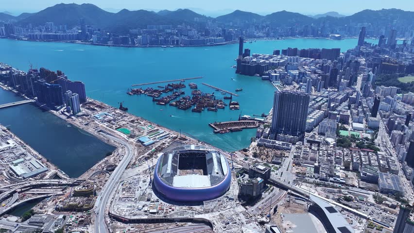 Seaside commercial residential construction project in Kai Tak Sports Park Cruise Terminal Hong Kong, Kwun Tong and Kowloon Bay near Victoria harbour, Aerial drone skyview