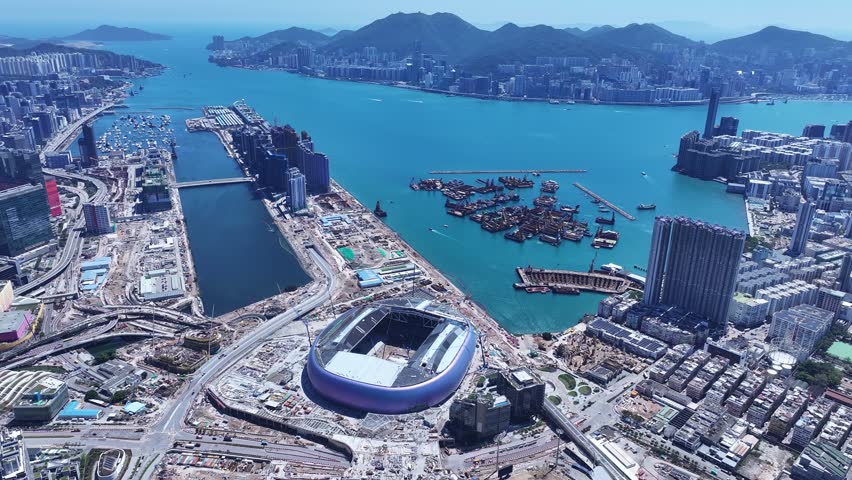 Seaside commercial residential construction project in Kai Tak Sports Park Cruise Terminal Hong Kong, Kwun Tong and Kowloon Bay near Victoria harbour, Aerial drone skyview