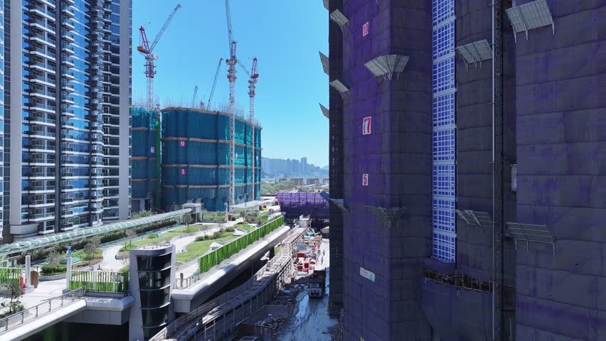 Seaside commercial residential construction project in Kai Tak Sports Park Cruise Terminal Hong Kong, Kwun Tong and Kowloon Bay near Victoria harbour, Aerial drone skyview
