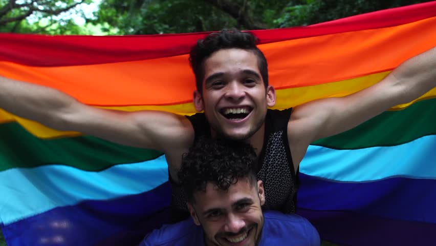 Gay Couple Piggybacking with Rainbow Flag Royalty-Free Stock Footage #34719829