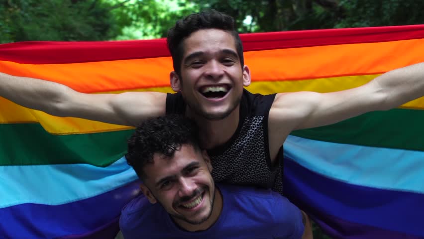 Gay Couple Piggybacking with Rainbow Flag