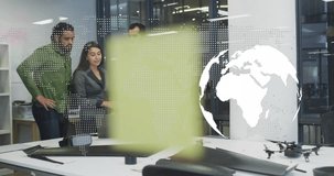 Animation of world map and globe over diverse colleagues discussing work in office. Technology, business and digital interface concept digitally generated video.
