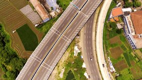 Drone Footage. Shot in 4K Resolution 30 Fps. Aerial shot of Cileunyi Highway overpass, highway towards the Purbaleunyi Toll Road gate, Bandung, West Java Indonesia, Asia.