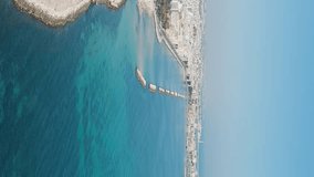 Vertical video. Bari, Italy. The central embankment of the city during the day. Lungomare di Bari. Summer. Bari - a port city on the Adriatic coast, Aerial View, Point of interest