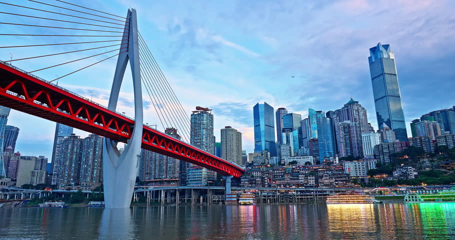 Chongqing modern city buildings skyline and bridges with river at sunset
