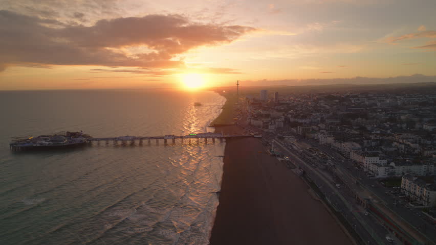 Super Sunset, T Shaped Light, Establishing Aerial View Shot of Brighton UK, Brighton and Hove, England United Kingdom, sunset, golden hour Royalty-Free Stock Footage #3472162339