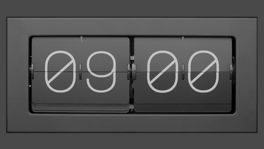 Flip clock quickly flips. Close up.  Retro flip clock changing from 08:59 to 09:00