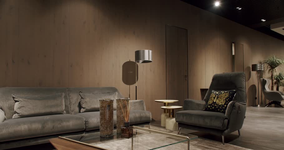 Modern contemporary Minimalist living room with gray furniture and wooden wall. Luxury Modern House Interior with gray Sofa, Chairs. Fashionable furniture. Real Estate private home.