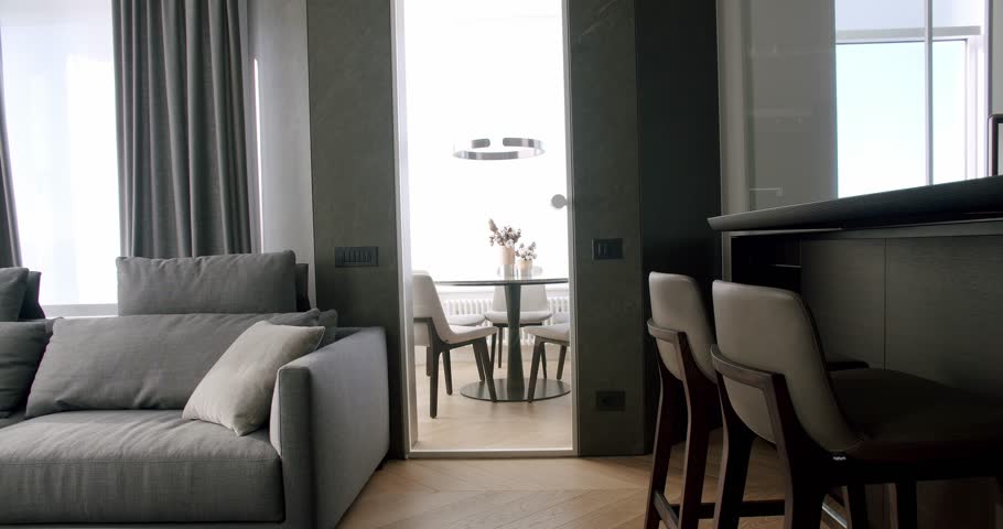 Real Modern Apartment Minimalist Furniture and luxury door. Bar stool furniture in Minimalist Interior. Home Details. Bar stools, Modern gray Furniture in Minimalist Interior with transparent door.  Royalty-Free Stock Footage #3472197645
