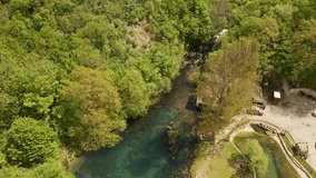 Drone video of beautiful lake, woods and waterfall in nature reserve