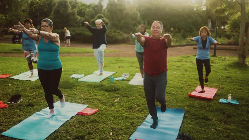 Senior people doing workout activity in a public park - Health elderly people lifestyle