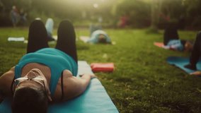 Close up senior woman doing workout activity with a group of friends in a public park - Health elderly people lifestyle - Powered by Shutterstock - Get 15% off with code: PIKWIZARD15