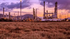 time-lapse day to night of chemical oil refinery plant, power plant on sunset sky background power electric plant Factory Pipeline Aerial View background