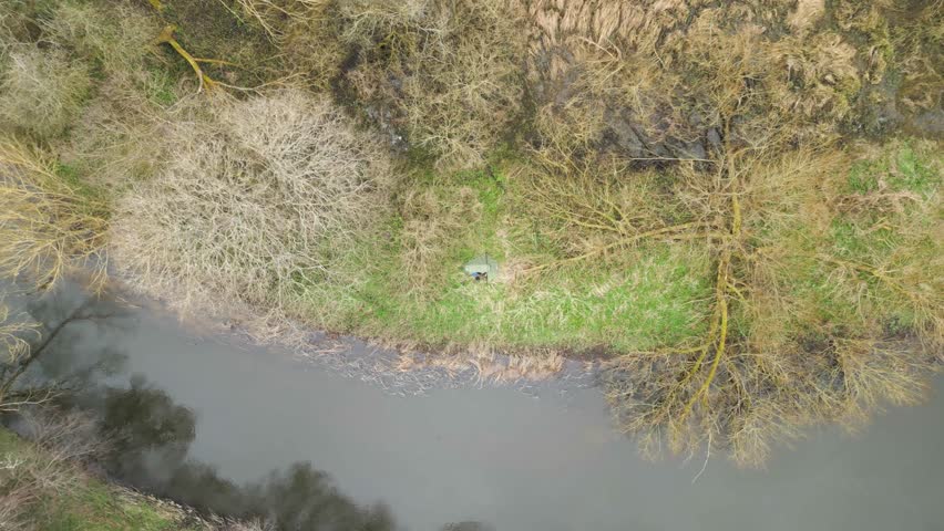 Drone Descend On A Tent Near The Swamp. Aerial Shot