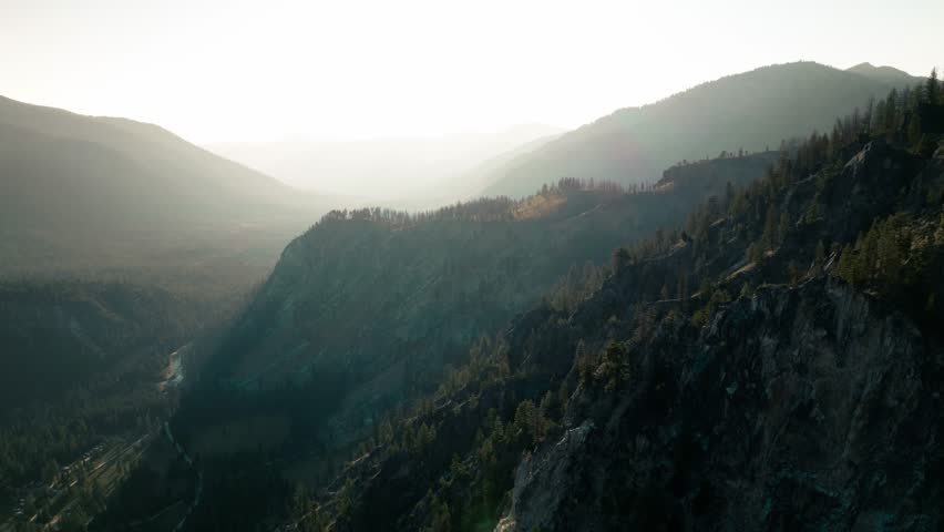Aerial drone time lapse hyper lapse of Sawtooth Mountains in Idaho, USA.  Beautiful rugged mountain range in western United States.  Located near Stanley, Idaho with breathtaking alpine lake. 