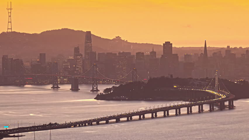 Sunset to night time timelapse of San Francisco – Oakland Bay Bridge and Yerba Buena Island 