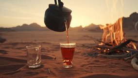 Tea poured in a glass at the Camp Fire in Jordan Wadi Rum desert - Powered by Shutterstock - Get 15% off with code: PIKWIZARD15