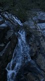 Vertical Video of Waterfall in the Mountains Aerial View
