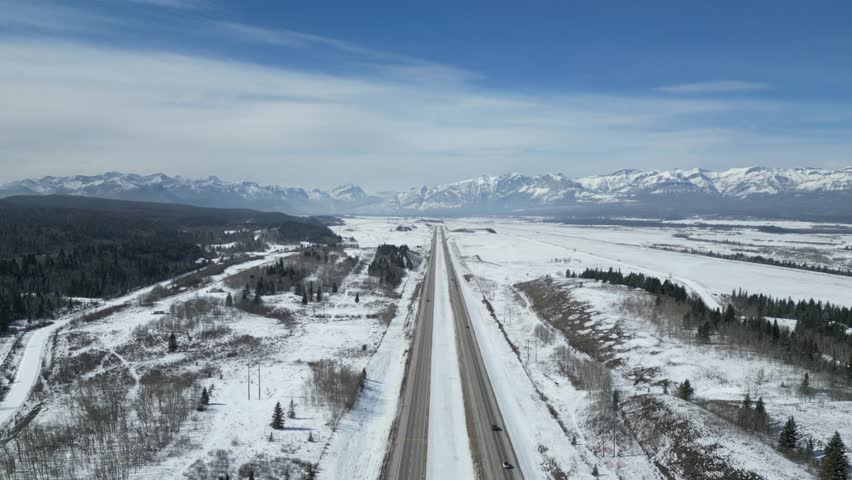 The Kalanaskis Mountain Ranges from Calgary to Canmore drone aerial on sunny day Royalty-Free Stock Footage #3472618203