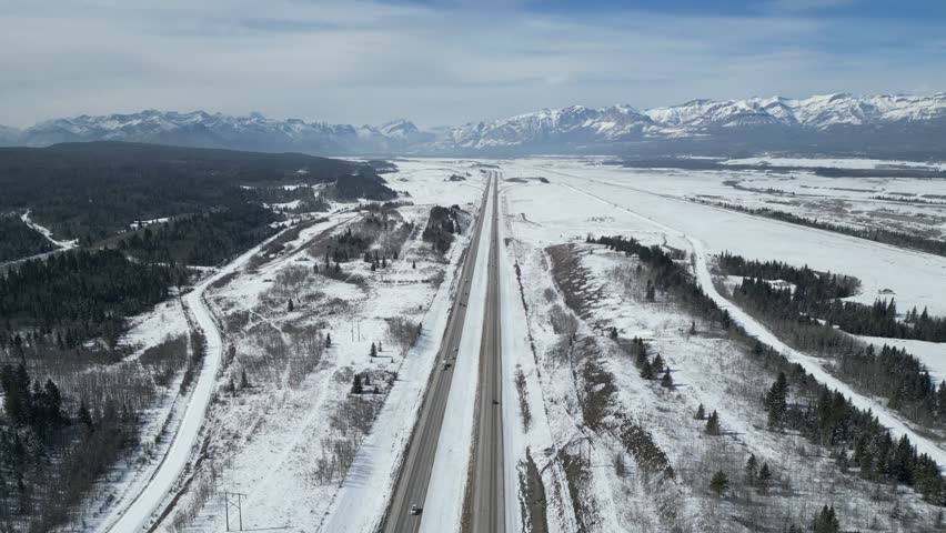 The Kalanaskis Mountain Ranges from Calgary to Canmore drone aerial on sunny day Royalty-Free Stock Footage #3472618227