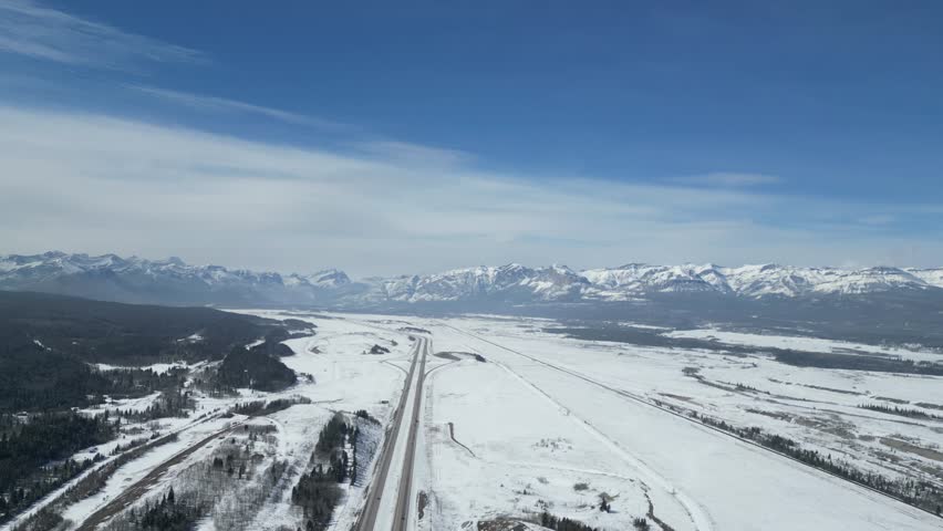 The Kalanaskis Mountain Ranges from Calgary to Canmore drone aerial on sunny day Royalty-Free Stock Footage #3472618563