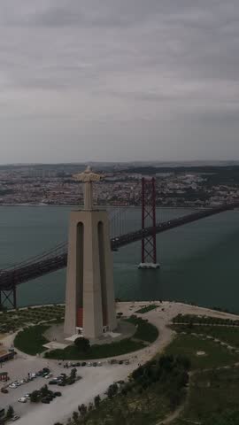 Vertical Video of Jesus Christ King Statue in Almada Lisbon Portugal Aerial View