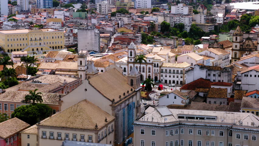 Aerial view of Terreiro de Jesus square close to Pelourinho with colorful buildings and the sea at background, Salvador, Bahia, Brazil