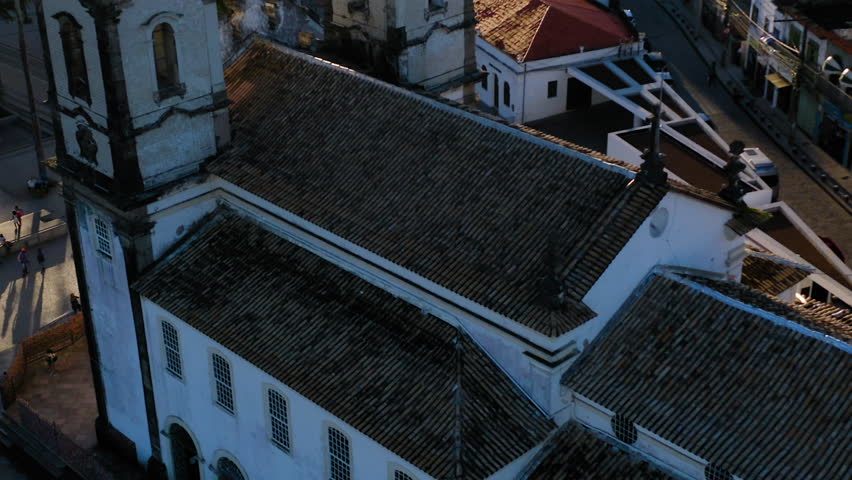 Aerial view of Nosso Senhor do Bonfim church back side, the neighbourhood and the ocean at background, Salvador, Bahia, Brazil