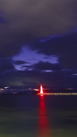 A beach under the stars. with night storm clouds. Vertical video for social media