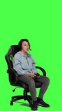 Side view Furious displeased gamer losing video games multiplayer tournament with her friends on online connection, greenscreen backdrop. Angry woman lost shooter competition, gaming setup. Camera A.