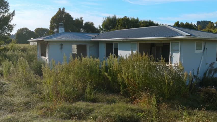 Abandoned and destroyed house one year on from Cyclone Gabrielle, Eskdale, Napier, Hawkes Bay, New Zealand. 