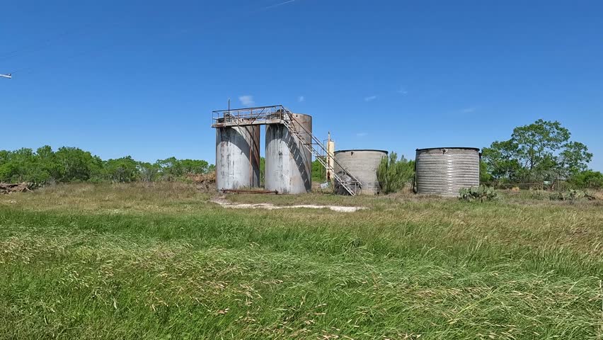 Abandoned oil tanks in South Texas near the unincorporated community of Dewees in Wilson County 