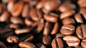 Dark coffee beans. Rotation. Coffee beans. Close up of coffee seeds. Beautiful coffee seeds. 4K