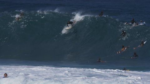 HALEIWA, UNITED STATES OF AMERICA - DECEMBER, 7, 2017: 4K 60p shot of a surfer under the lip at pipeline on the island of oahu in hawaii