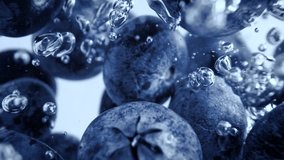 Super Slow Motion Shot of Fresh Blueberries Falling into Water and Creating Bubbles at 1000fps. - Powered by Shutterstock - Get 15% off with code: PIKWIZARD15