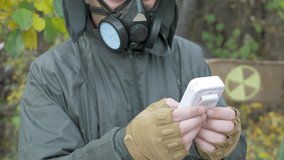 Unrecognizable radiation supervisor use Geiger counter. international symbol of ionizing radiation background. Radioactivity, that are unsafe for unshielded humans - Powered by Shutterstock - Get 15% off with code: PIKWIZARD15