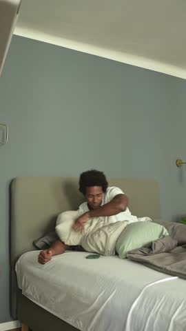 Man wakes up to sound of his mobile phone ringing while lying in bed