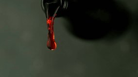 Super Slow Motion of Pouring Red Wine With Camera Motion. Filmed on High Speed Cinema Camera, 1000 fps. Camera Follows the Stream into Glass. - Powered by Shutterstock - Get 15% off with code: PIKWIZARD15