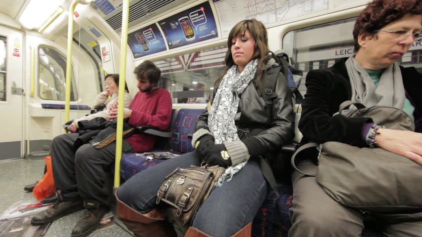 LONDON - OCTOBER 8: Unidentified people sit in train carriage on Oct 12, 2012.