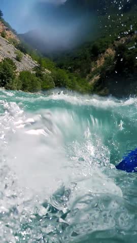 White Water Rafting - Paddling in River Rapids. Whitewater Rafting Team Descending Raging Rapids. Underwater Camera Shots. Active Outdoors Pursuit. Active Living.