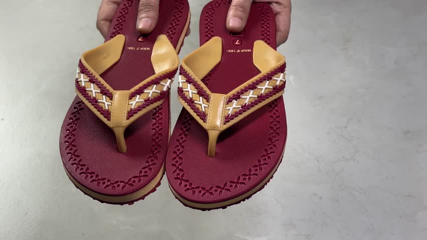 Close-up view 4k stock video footage of new pair of soft and flexible eva slippers in hands of woman Royalty-Free Stock Footage #3473252491